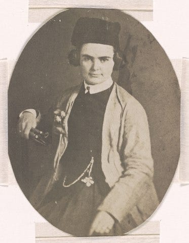 Studio portrait Harriet Hosmer holding her sculpting tools. Image courtesy of Wikimedia Commons.