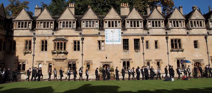  Oxford students on their way to matriculation ceremonies — held in Latin. (Source: Wikimedia Commons)
