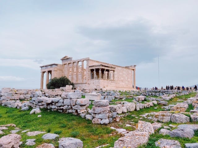  Last visitors greeted by the Karyatids.