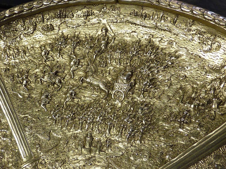  A scene from the tazza ascribed to Domitian, but with a scene from the life of Tiberius: the infant Tiberius is carried by his mother through a forest fire (image courtesy of the Victoria and Albert Museum).