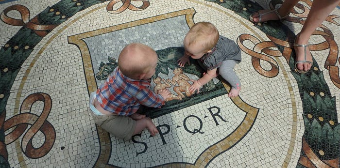 Our twins communing with a mosaic of another set of twins, in Milan.