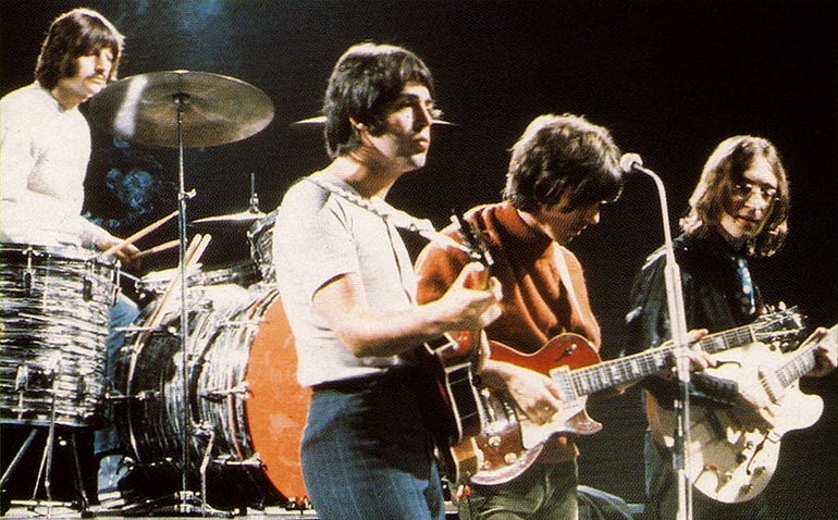  The Beatles, with Paul McCartney’s left-handed guitar playing. (Modified image from Lawren’s Flickr)
