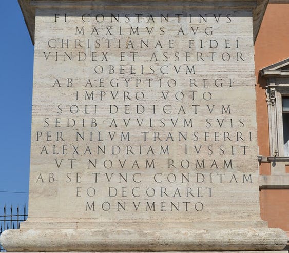  The beginning of the Renaissance-era inscription on the sides of the base.

